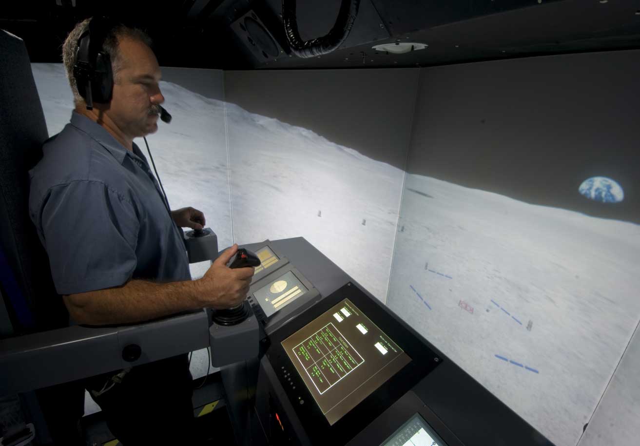 Picture of a pilot operating the Lunar Lander in the VMS